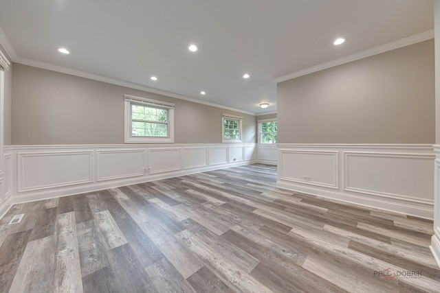 36586 N Traer Ter, Gurnee, IL 60031 - spare room with ornamental molding, recessed lighting, wood finished floors, wainscoting, and a decorative wall
