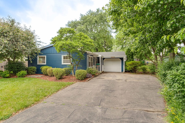 36586 N Traer Ter, Gurnee, IL 60031 - view of front facade featuring driveway, an attached garage, and a front lawn