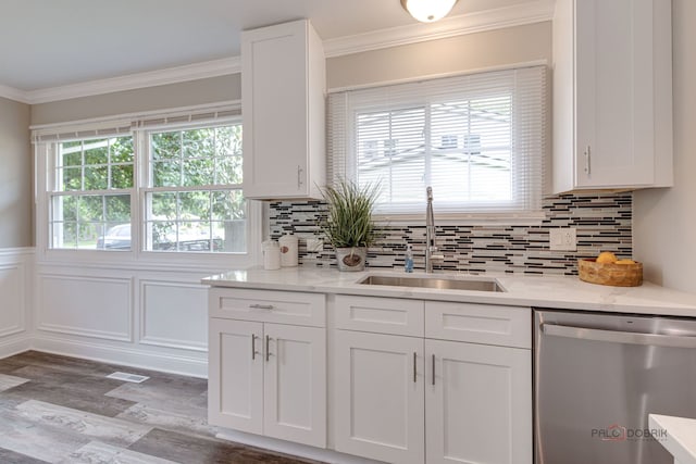 36586 N Traer Ter, Gurnee, IL 60031 - kitchen with stainless steel dishwasher, wood finished floors, white cabinetry, crown molding, and tasteful backsplash