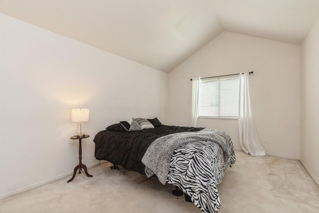 1714 Daybreak Ln, Zion, IL 60099 - carpeted bedroom featuring vaulted ceiling and baseboards