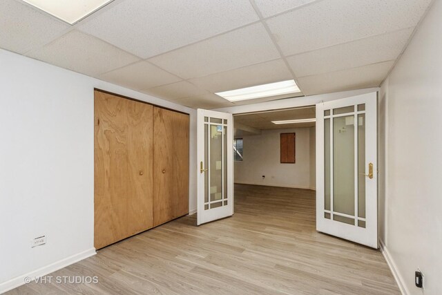 1714 Daybreak Ln, Zion, IL 60099 - unfurnished bedroom with a paneled ceiling, light wood-type flooring, baseboards, and a closet