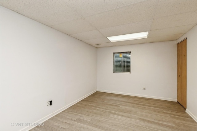 1714 Daybreak Ln, Zion, IL 60099 - spare room featuring a drop ceiling, light wood-style floors, and baseboards