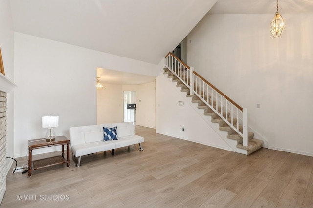 1714 Daybreak Ln, Zion, IL 60099 - sitting room with stairway, wood finished floors, a chandelier, and baseboards