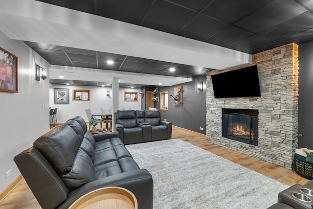 373 W Joliet Hwy, New Lenox, IL 60451 - living area featuring wood finished floors, a stone fireplace, and a drop ceiling
