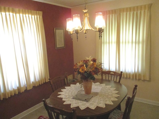 10918 S Ridgeway Ave, Chicago, IL 60655 - dining area with healthy amount of natural light, a chandelier, baseboards, and ornamental molding