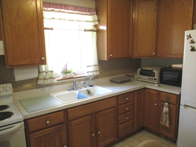 10918 S Ridgeway Ave, Chicago, IL 60655 - kitchen with white appliances, a sink, light countertops, and brown cabinets