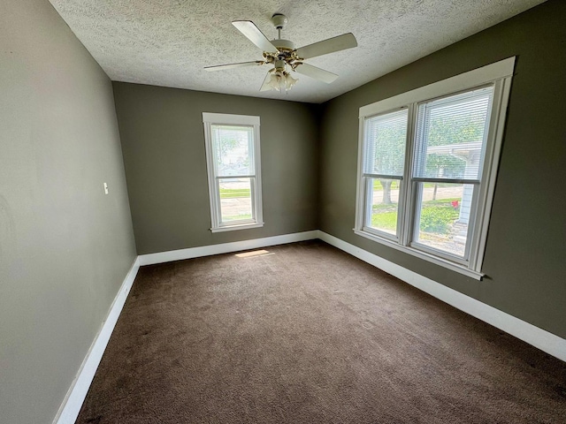 1303 W Locust St, Bloomington, IL 61701 - unfurnished room featuring carpet, baseboards, a textured ceiling, and ceiling fan