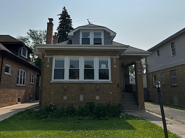 2029 S 11th Ave, Maywood, IL 60153 - bungalow-style house with a front lawn and brick siding