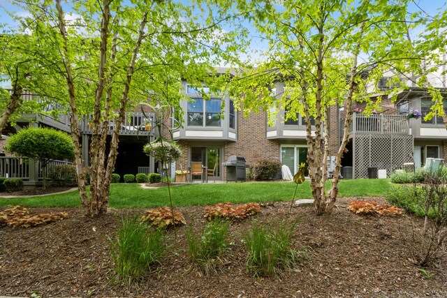 14613 Morningside Rd, Orland Park, IL 60462 - back of house featuring a lawn and brick siding