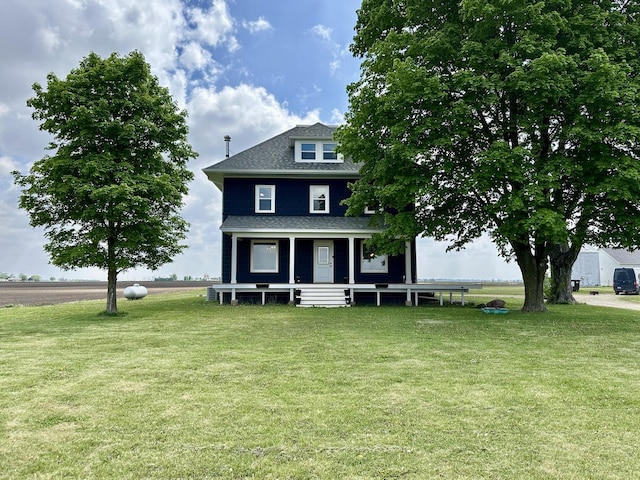 2034 Gittleson Rd, Rochelle, IL 61068 - view of front of property featuring a front lawn, a porch, and a shingled roof