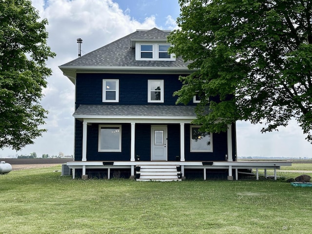 2034 Gittleson Rd, Rochelle, IL 61068 - view of front of home featuring a front yard, a shingled roof, and covered porch