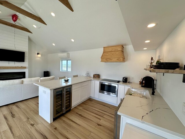 2034 Gittleson Rd, Rochelle, IL 61068 - kitchen with open floor plan, custom range hood, wine cooler, a peninsula, and wall oven