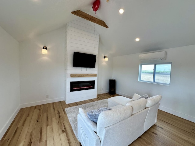 2034 Gittleson Rd, Rochelle, IL 61068 - living area featuring a wall mounted air conditioner, a large fireplace, wood finished floors, recessed lighting, and baseboards
