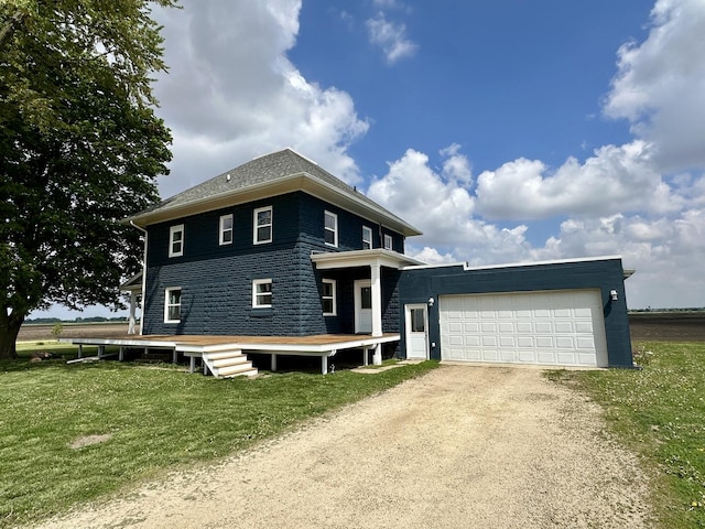 2034 Gittleson Rd, Rochelle, IL 61068 - view of front facade featuring dirt driveway, a front lawn, and a deck