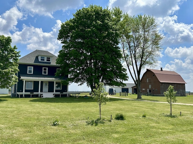 2034 Gittleson Rd, Rochelle, IL 61068 - view of front of home featuring a barn, a front lawn, an outbuilding, and covered porch