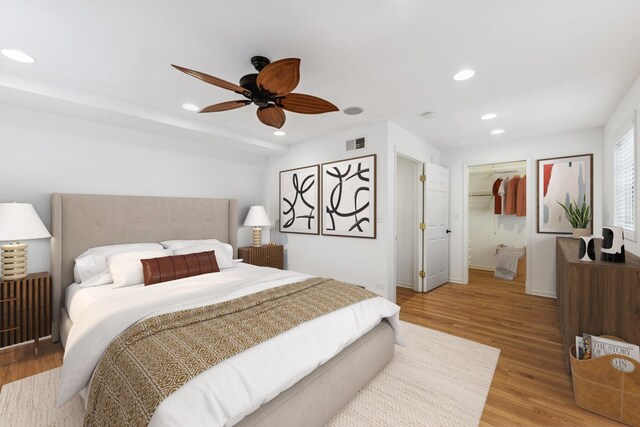 914 Meadowcrest Rd, La Grange Park, IL 60526 - bedroom featuring light wood-style flooring, recessed lighting, baseboards, ceiling fan, and a walk in closet