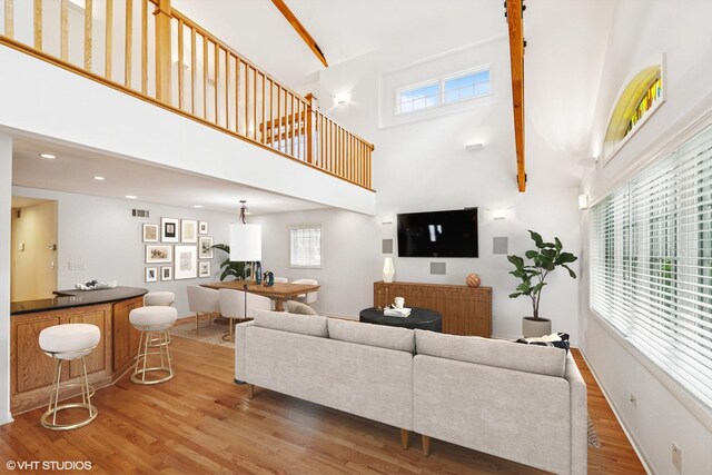 914 Meadowcrest Rd, La Grange Park, IL 60526 - living room featuring a high ceiling, light wood finished floors, and a bar