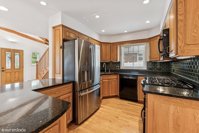 914 Meadowcrest Rd, La Grange Park, IL 60526 - kitchen with black appliances, a sink, light wood finished floors, tasteful backsplash, and brown cabinets