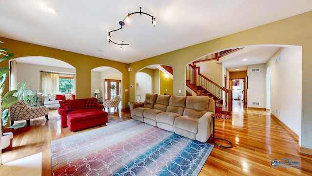 1535 S Douglas Ave, Arlington Heights, IL 60005 - living area with wood finished floors, arched walkways, stairs, and track lighting