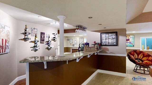 1535 S Douglas Ave, Arlington Heights, IL 60005 - kitchen featuring ornate columns, light stone counters, recessed lighting, a kitchen breakfast bar, and a peninsula