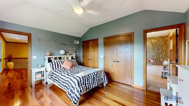 1535 S Douglas Ave, Arlington Heights, IL 60005 - bedroom with vaulted ceiling, wood finished floors, two closets, and ceiling fan