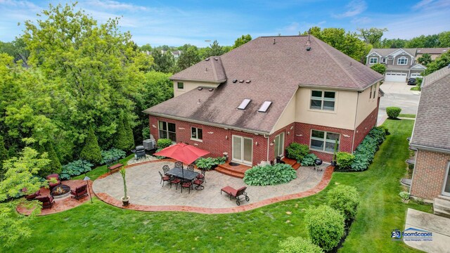 1535 S Douglas Ave, Arlington Heights, IL 60005 - back of house with a fire pit, brick siding, a patio area, a lawn, and a shingled roof