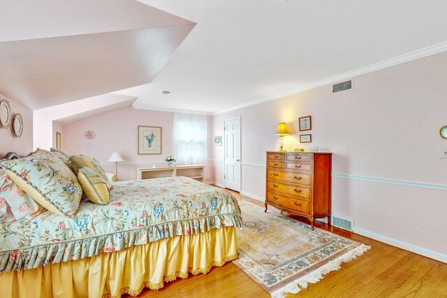 140 N Quincy St, Hinsdale, IL 60521 - bedroom with wood finished floors, baseboards, and vaulted ceiling