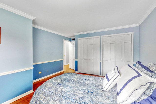 140 N Quincy St, Hinsdale, IL 60521 - bedroom with two closets, wood finished floors, and crown molding