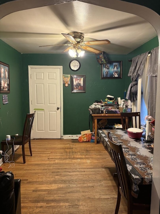 5314 S Lawndale Ave, Chicago, IL 60632 - dining area featuring arched walkways, wood finished floors, and ceiling fan