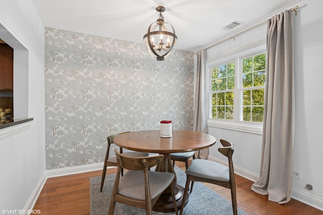 23 Foxcroft Rd Unit 235, Naperville, IL 60565 - dining area featuring wood finished floors, a chandelier, and wallpapered walls