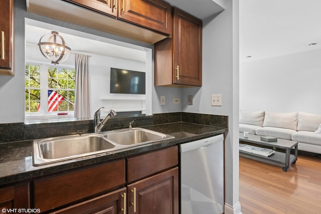 23 Foxcroft Rd Unit 235, Naperville, IL 60565 - kitchen featuring dishwasher, a chandelier, light wood-style floors, open floor plan, and dark stone counters