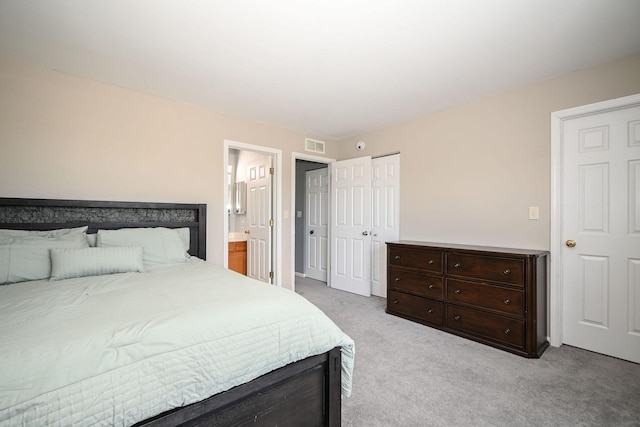 129 W Hampton Ct, Round Lake, IL 60073 - bedroom featuring light carpet and connected bathroom