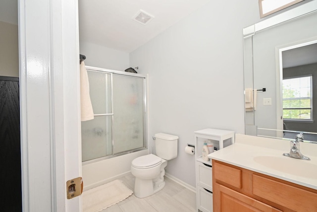 129 W Hampton Ct, Round Lake, IL 60073 - bathroom with vanity, toilet, enclosed tub / shower combo, baseboards, and tile patterned floors