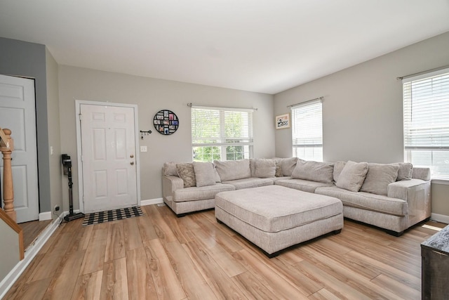 129 W Hampton Ct, Round Lake, IL 60073 - living room featuring light wood-style floors and baseboards