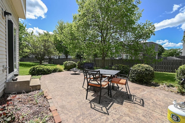 129 W Hampton Ct, Round Lake, IL 60073 - fenced backyard featuring a patio area, entry steps, and outdoor dining area