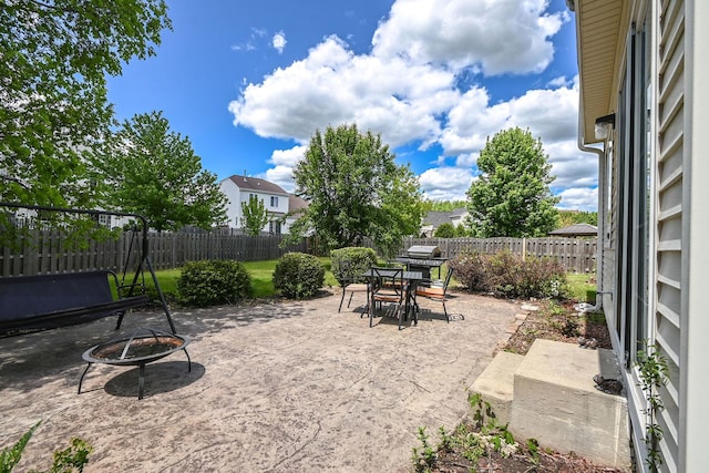 129 W Hampton Ct, Round Lake, IL 60073 - fenced backyard featuring a fire pit and a patio area