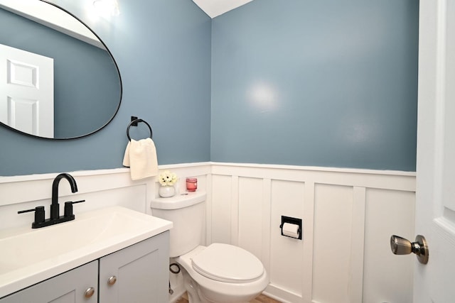 129 W Hampton Ct, Round Lake, IL 60073 - bathroom with a decorative wall, wainscoting, vanity, and toilet