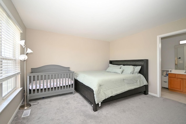 129 W Hampton Ct, Round Lake, IL 60073 - bedroom featuring multiple windows, light carpet, and baseboards