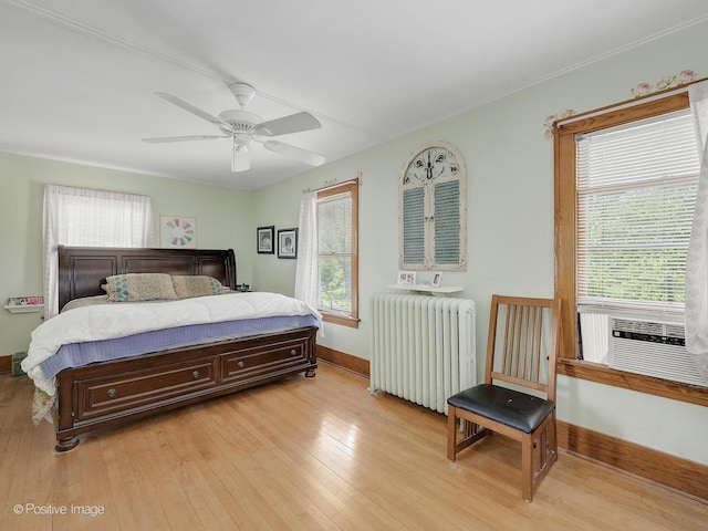 217 S Craig Pl, Lombard, IL 60148 - bedroom with radiator, light wood finished floors, baseboards, a ceiling fan, and cooling unit