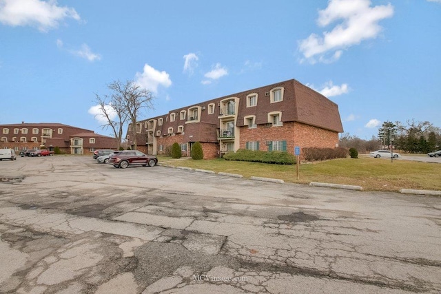 17985 Amherst Ct Unit 203, Country Club Hills, IL 60478 - view of building exterior featuring uncovered parking