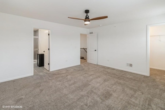 1533 Executive Way, Des Plaines, IL 60018 - unfurnished bedroom with a walk in closet, carpet floors, a closet, connected bathroom, and ceiling fan