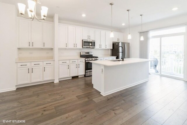 1533 Executive Way, Des Plaines, IL 60018 - kitchen with stainless steel appliances, dark wood-type flooring, white cabinetry, an island with sink, and recessed lighting