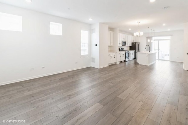 1533 Executive Way, Des Plaines, IL 60018 - unfurnished living room featuring wood finished floors, recessed lighting, and a chandelier