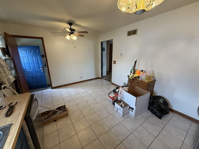3357 D Hutchison Ave, Joliet, IL 60431 - entrance foyer featuring light tile patterned floors, a ceiling fan, a chandelier, and baseboards