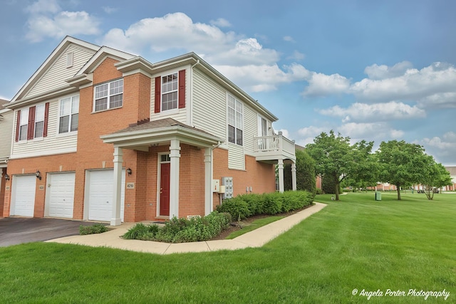 4219 Savoy Ln Unit 4219, Mchenry, IL 60050 - multi unit property with a garage, a front yard, asphalt driveway, and brick siding