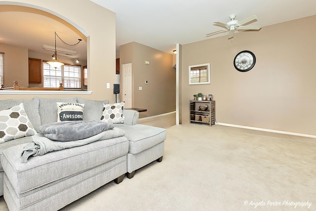 4219 Savoy Ln Unit 4219, Mchenry, IL 60050 - living area with a ceiling fan, arched walkways, light carpet, and baseboards