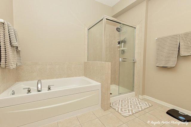 4219 Savoy Ln Unit 4219, Mchenry, IL 60050 - bathroom with a bath, a stall shower, and tile patterned flooring