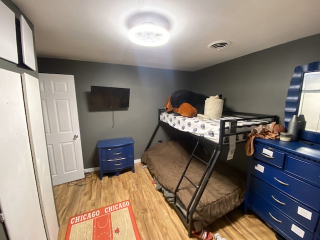 18020 Ridgeland Ave, Lansing, IL 60438 - bedroom with light wood-type flooring and baseboards