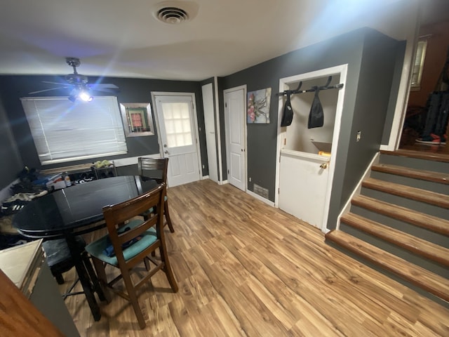 18020 Ridgeland Ave, Lansing, IL 60438 - dining space featuring light wood finished floors, a ceiling fan, and stairway