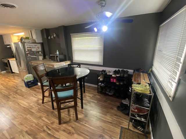 18020 Ridgeland Ave, Lansing, IL 60438 - dining space featuring light wood-style flooring and ceiling fan